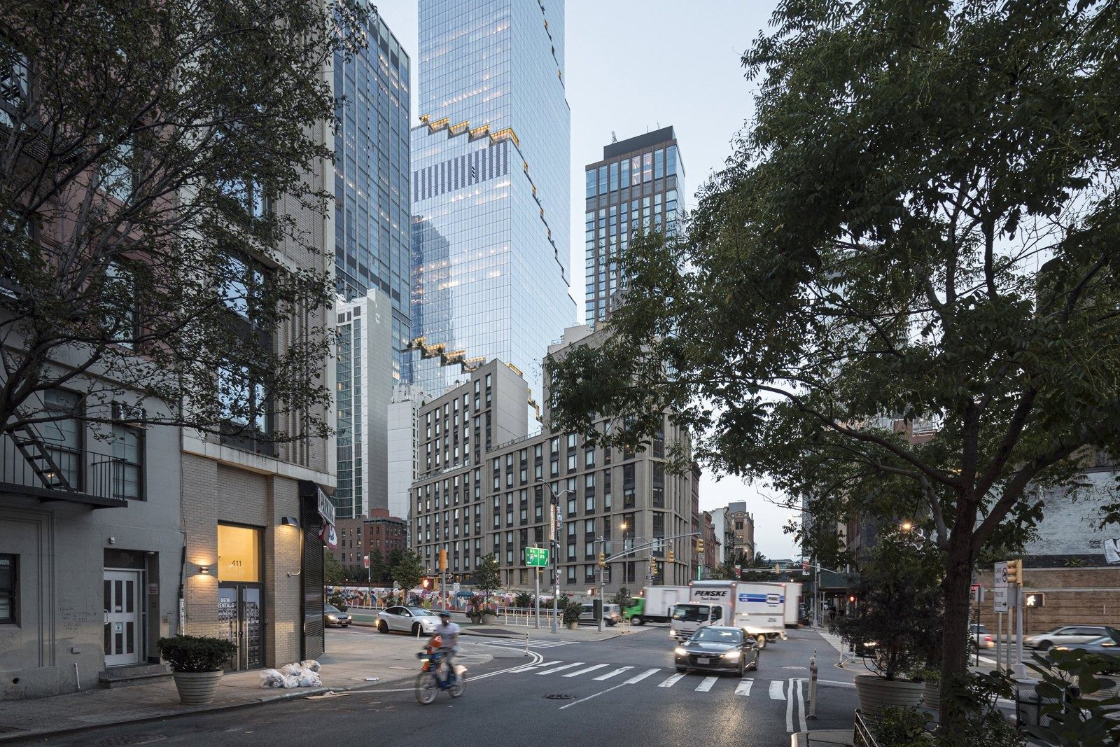 Pfizer: The tower rising over a tree-lined street