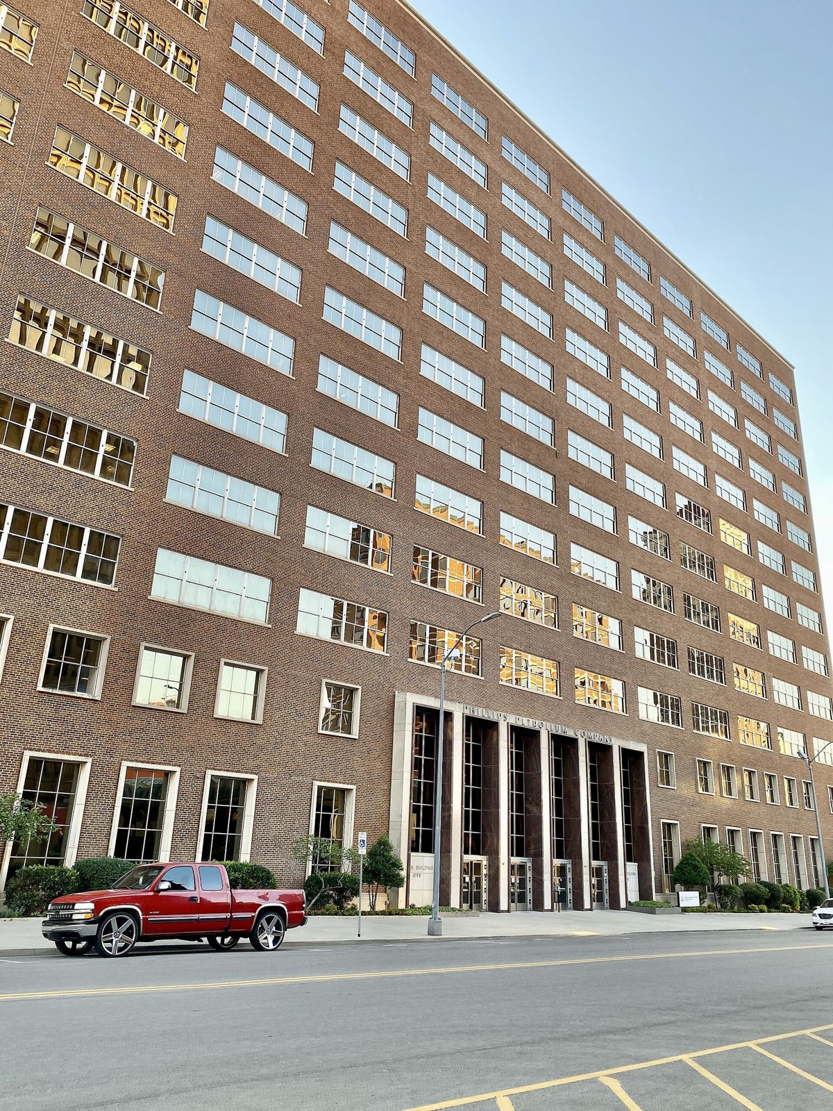 Phillips 66: A tall brick office building on a street corner