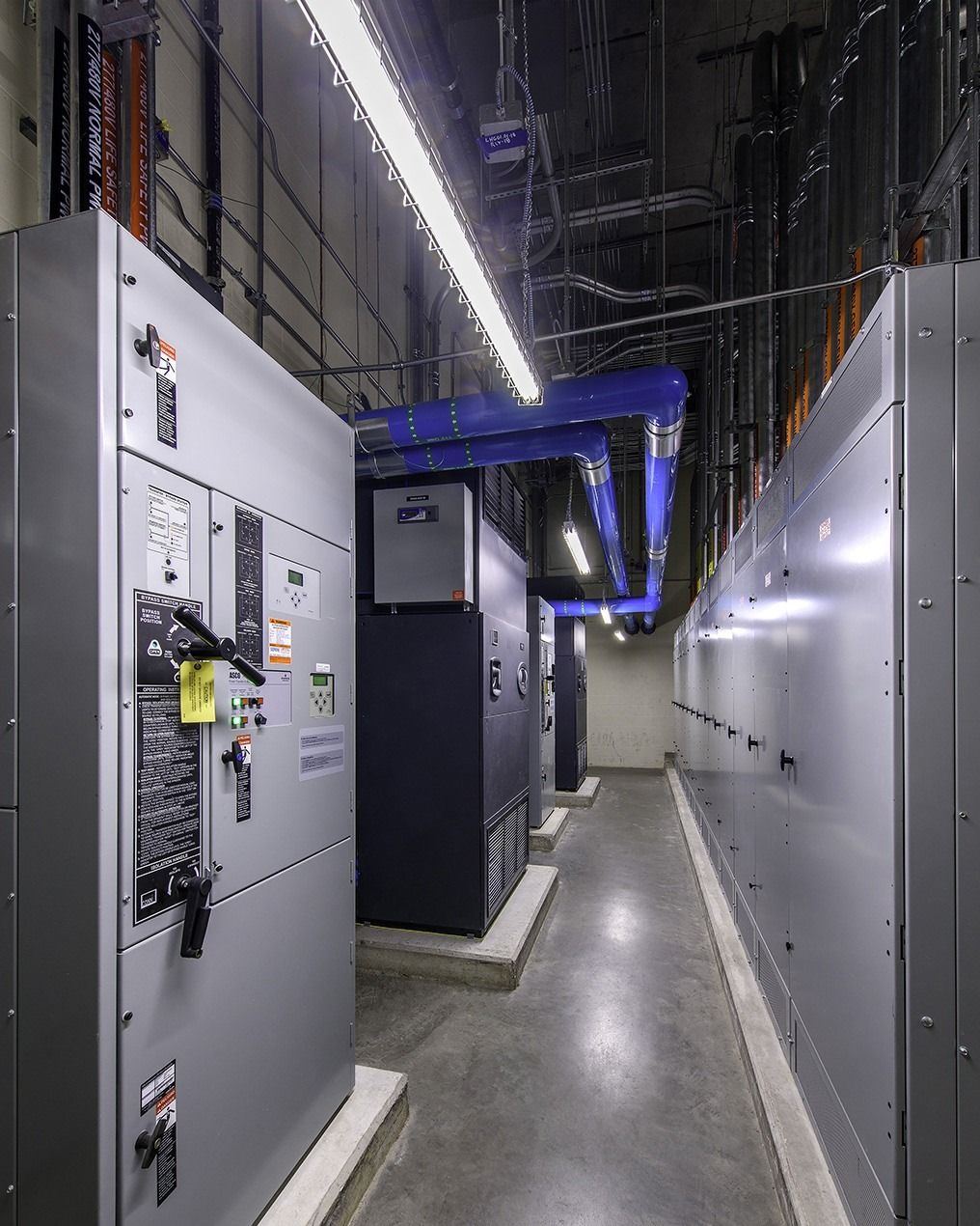 Phillips 66: Electrical cabinets along a narrow lit aisle