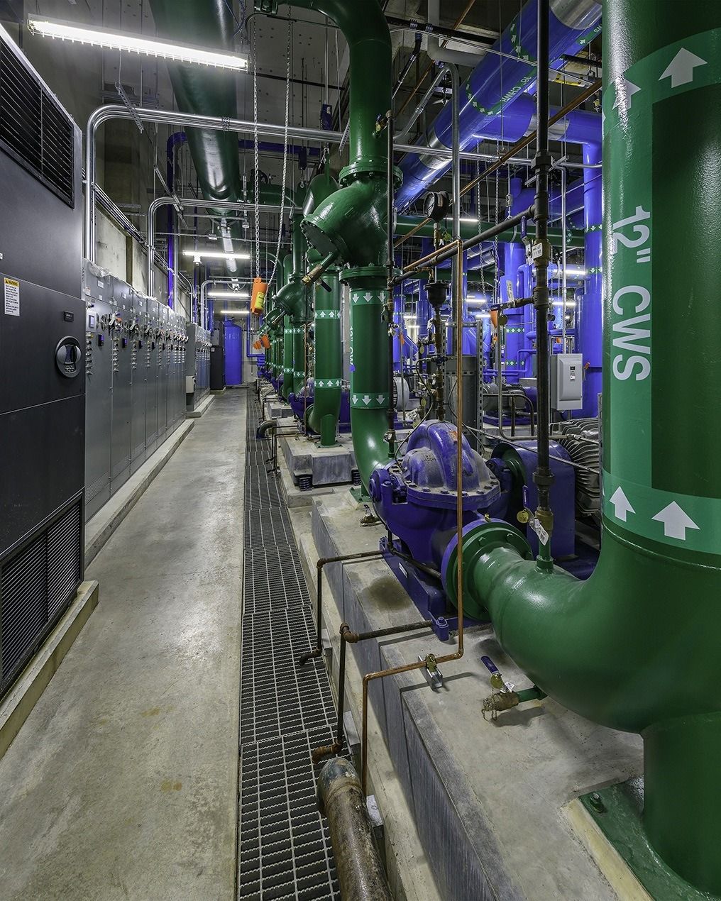 Phillips 66: Green pipes labeled with flow arrows in a plant room