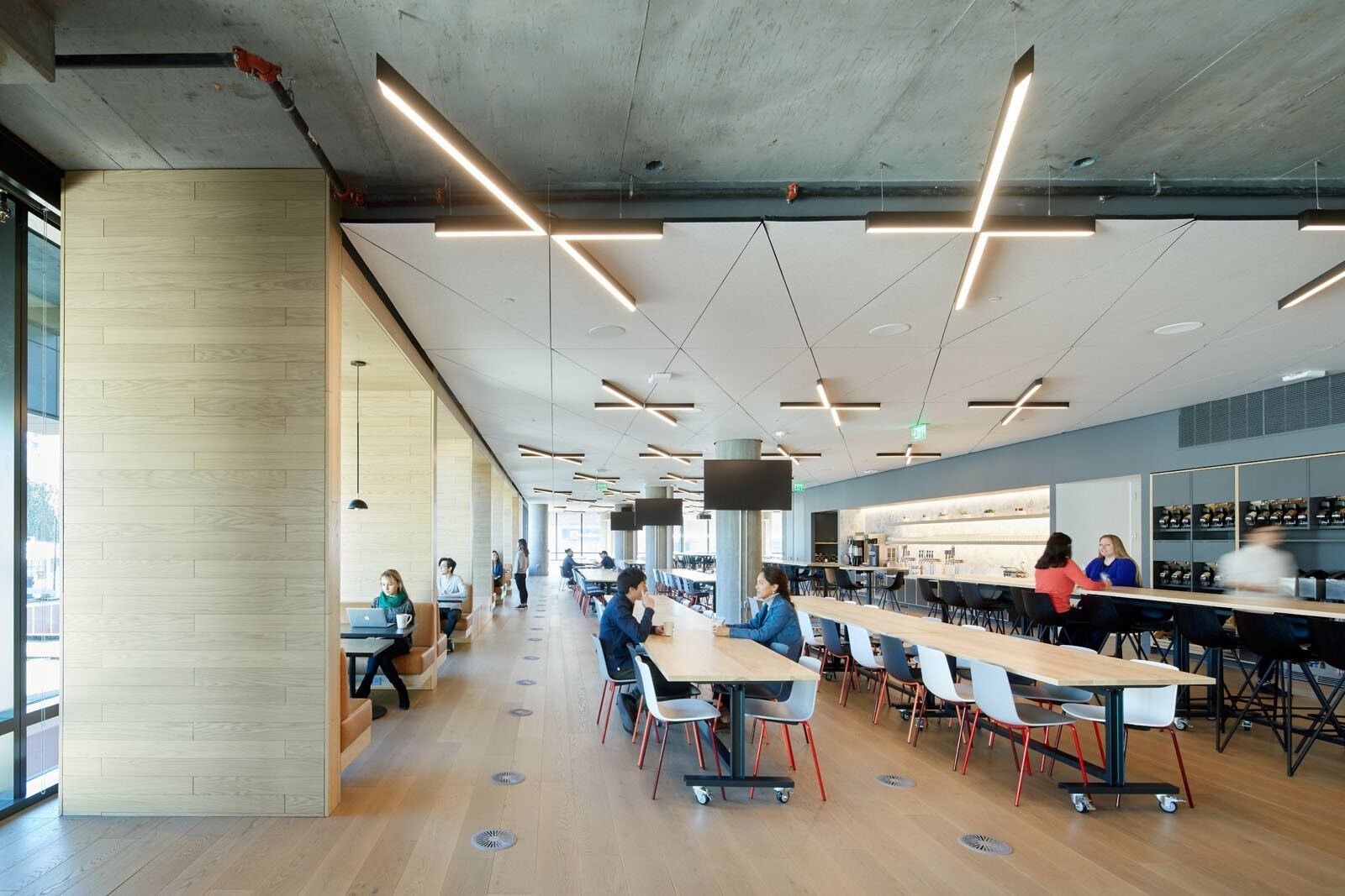 Pinterest: A long work table under linear lights