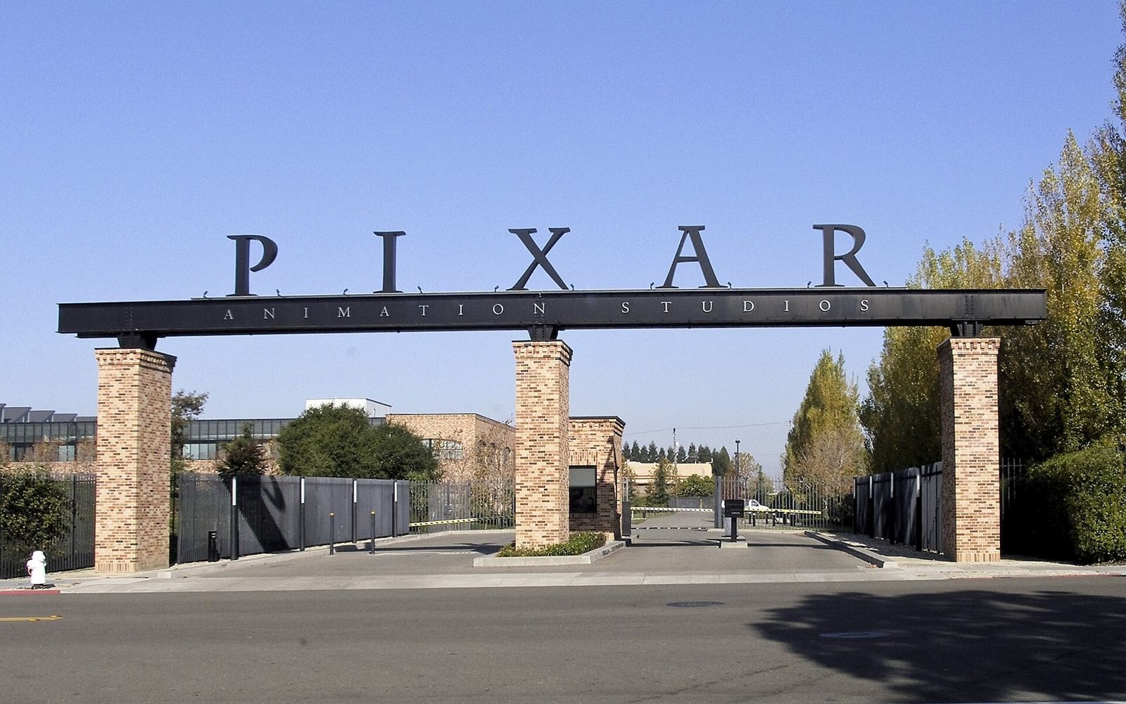 Pixar Animation Studios: Brick gateposts carrying a black beam with the letters PIXAR