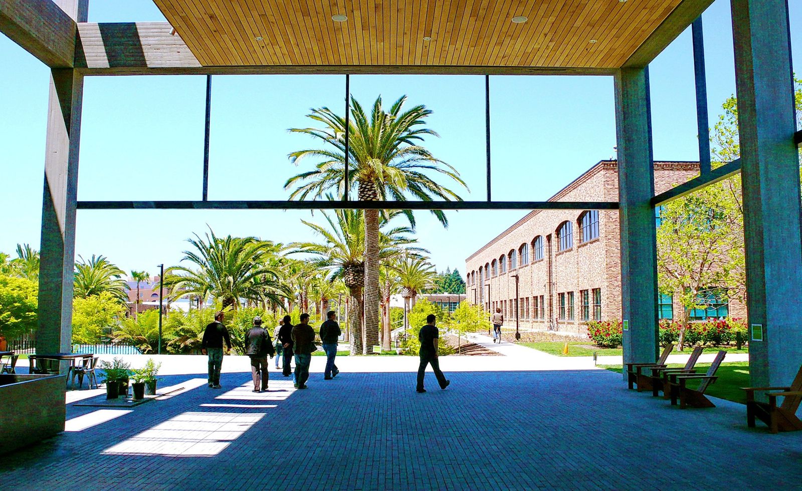Pixar Animation Studios: Covered porch looking out to palm trees and a brick building