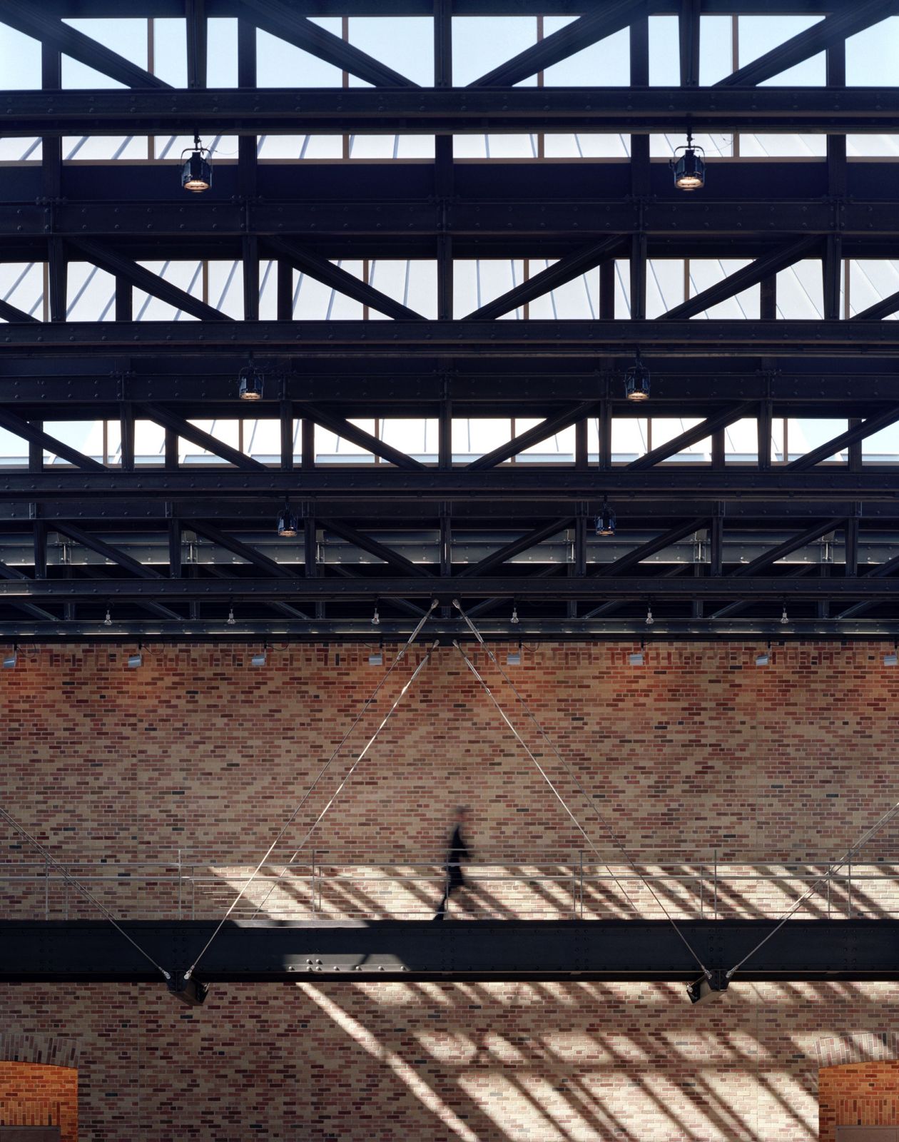 Pixar Animation Studios: Steel roof trusses and skylights over a brick wall