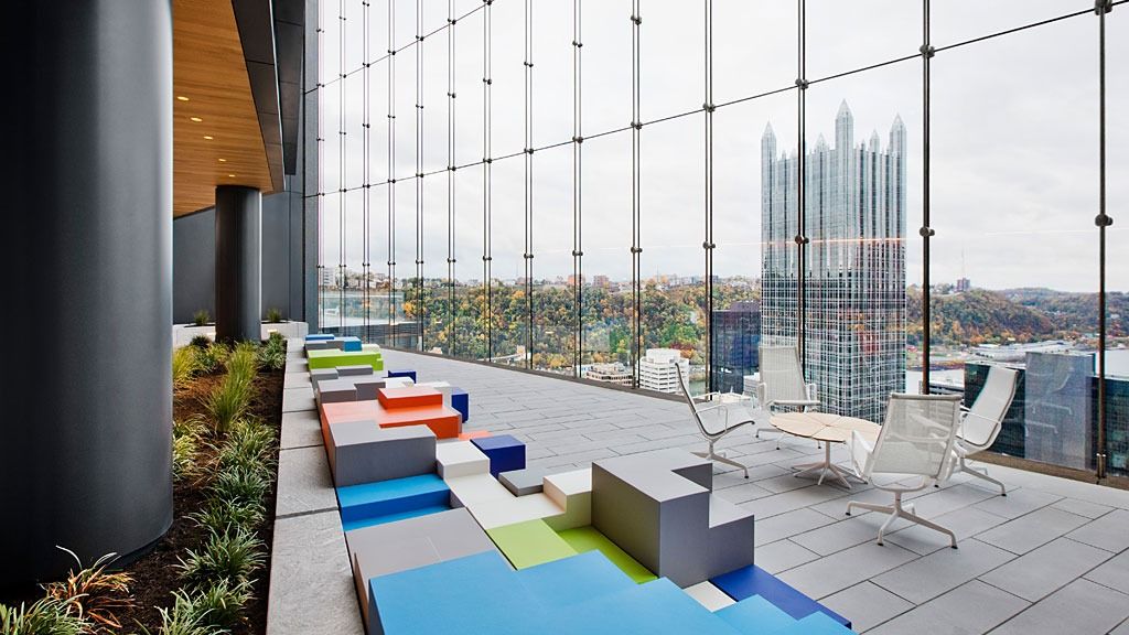 PNC Financial Services: Colorful block seats and planting along a glass wall