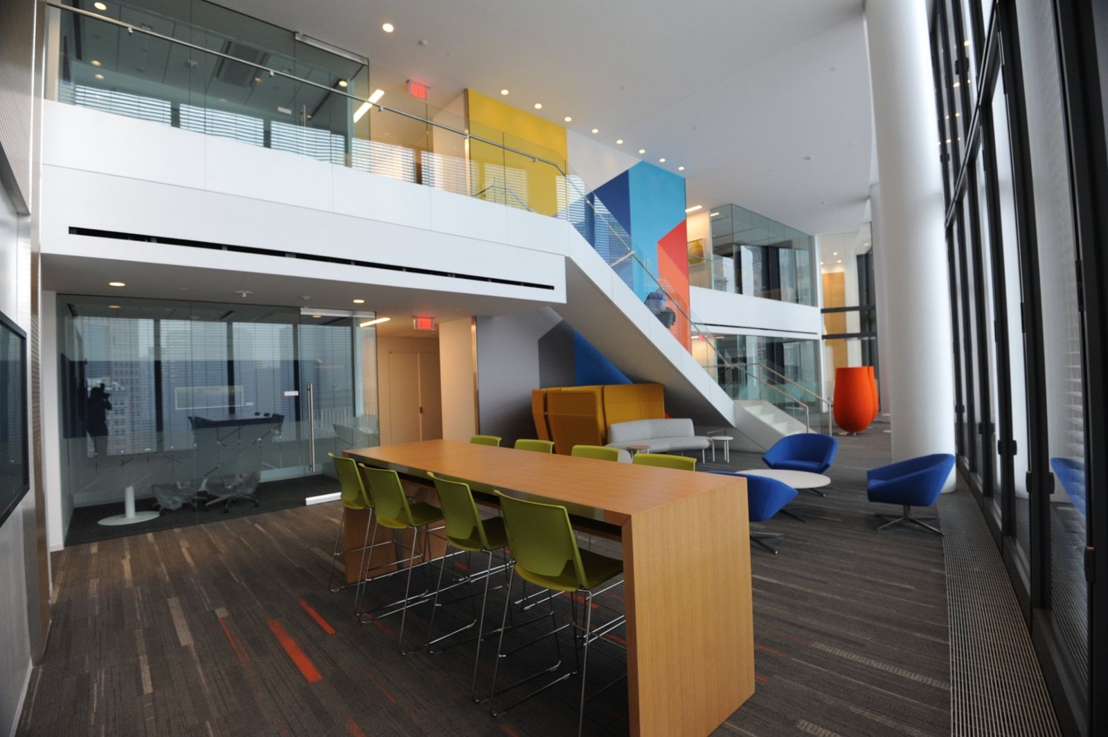PNC Financial Services: Double-height space with a long table and a stair to the floor above