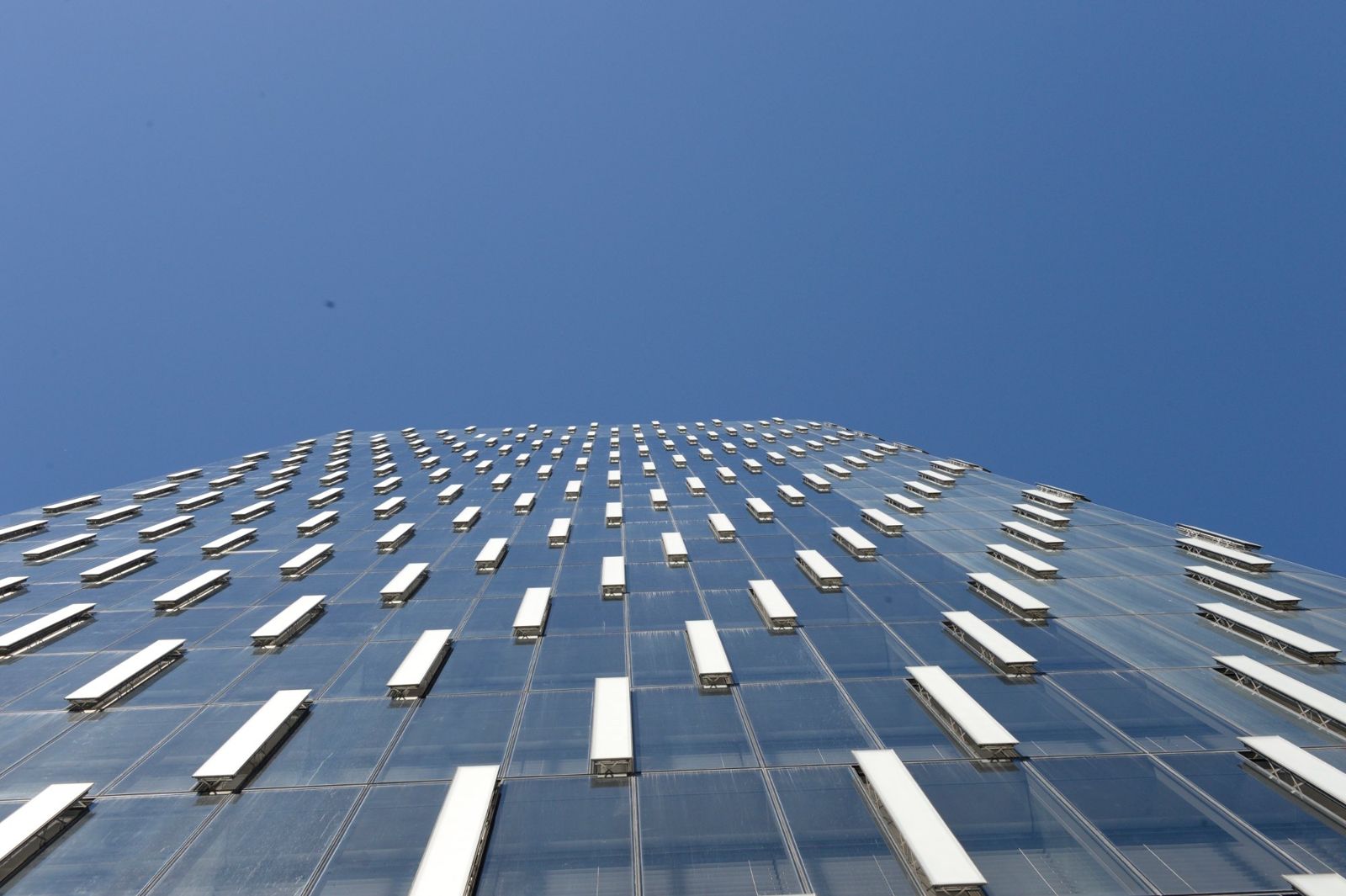 PNC Financial Services: Glass facade seen from below with rows of open panels