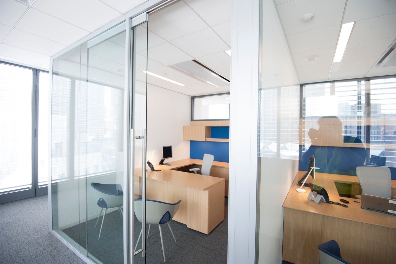 PNC Financial Services: Glass-walled private office with a wooden desk