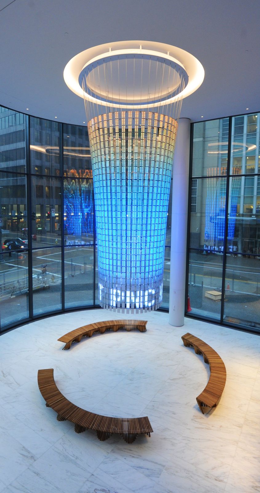 PNC Financial Services: Glowing blue column with the PNC logo inside a curved bench