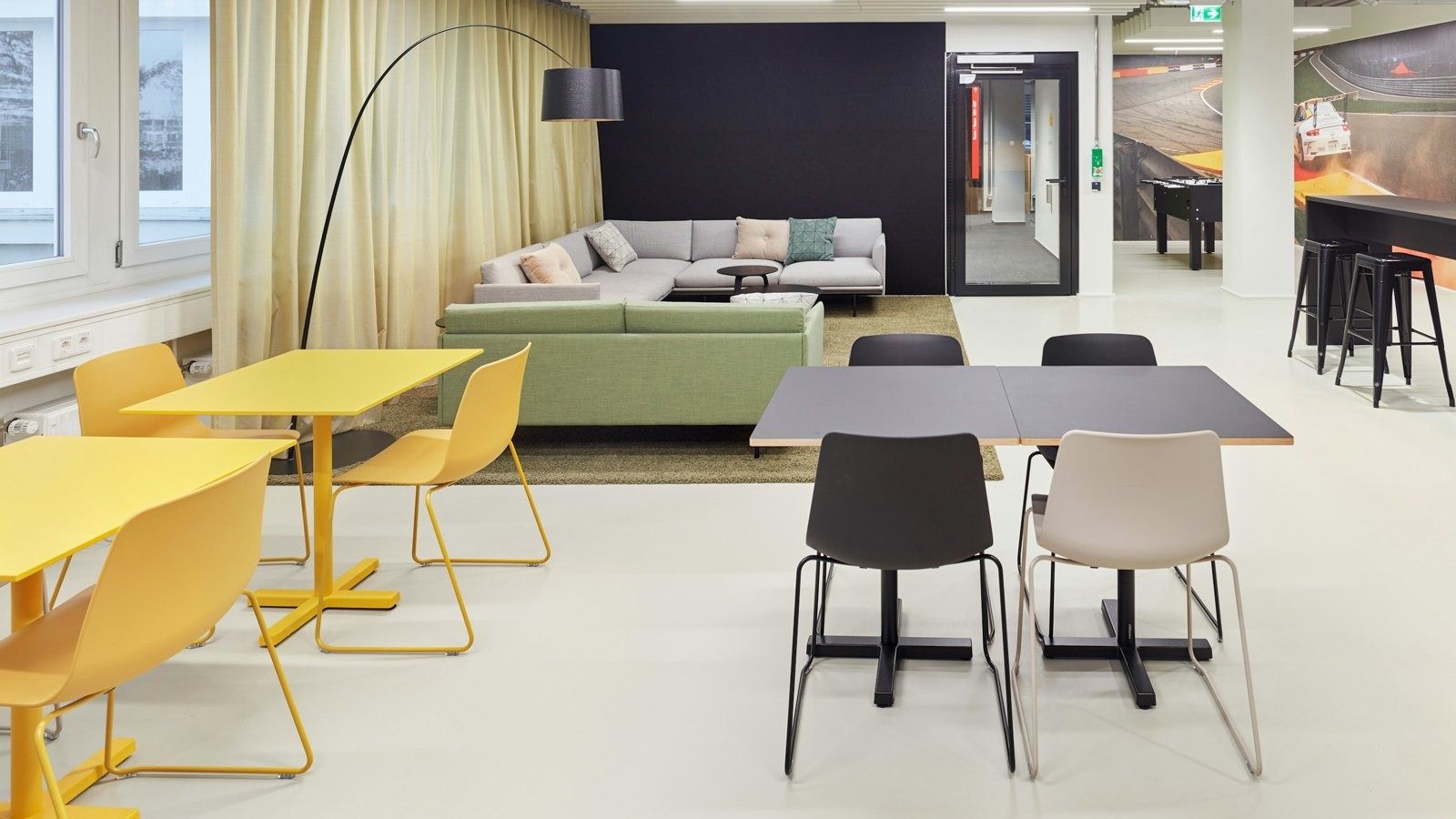 Office floor with yellow chairs and a lounge sofa