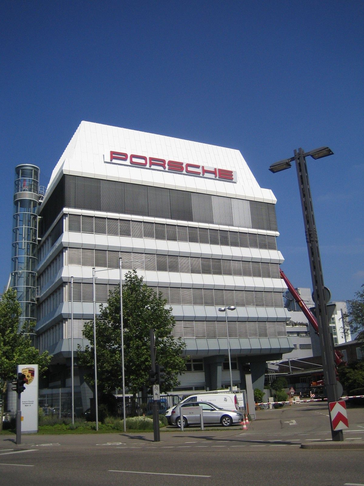 Porsche: White office building with the Porsche name on top