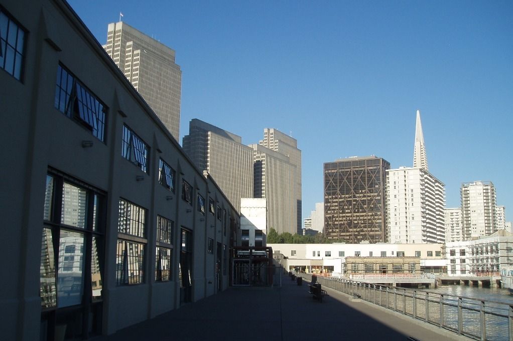 Prologis: A walkway along the side of a pier building with downtown towers beyond