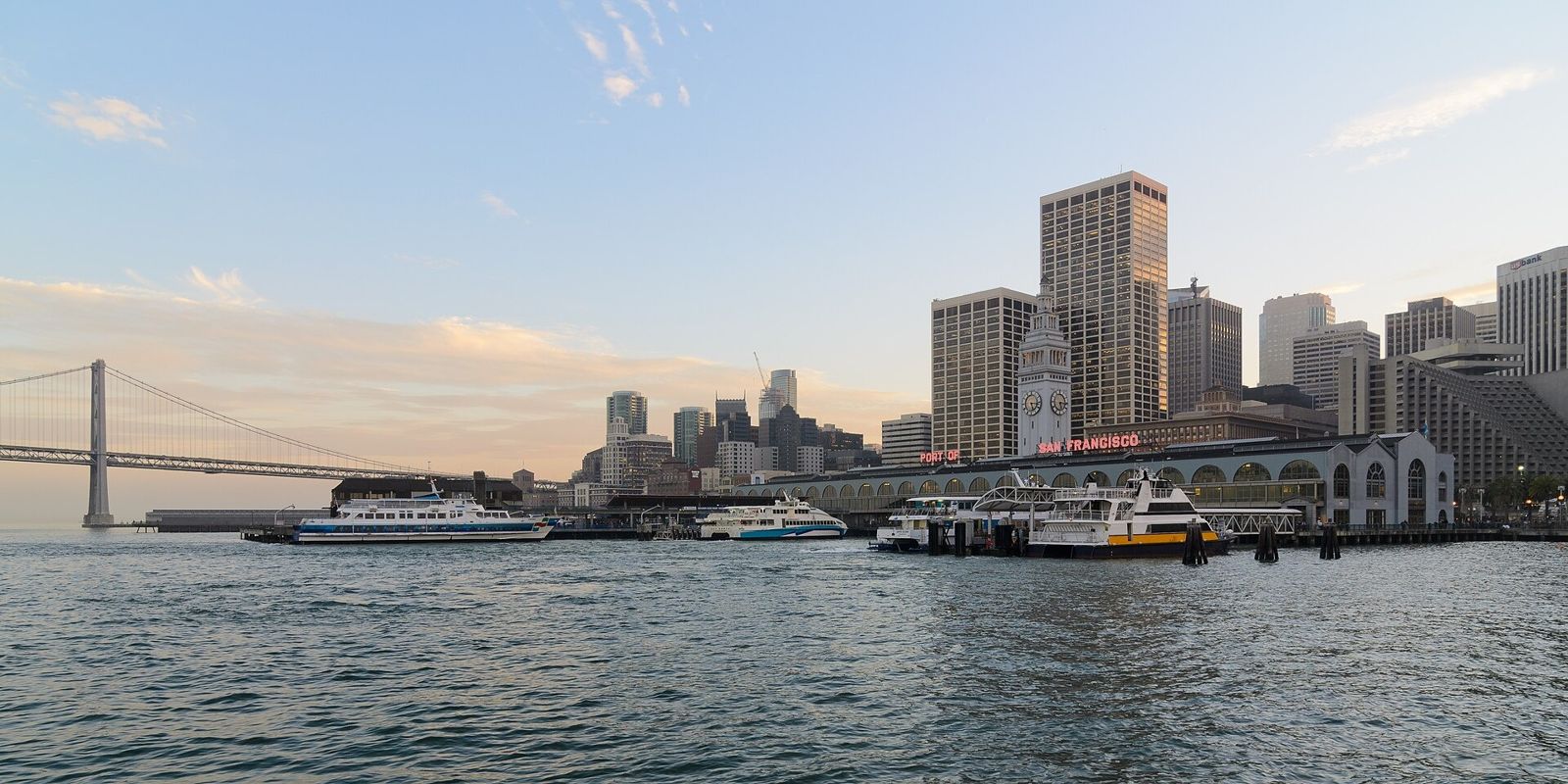 Prologis: The downtown San Francisco waterfront and Bay Bridge at sunset seen from the bay