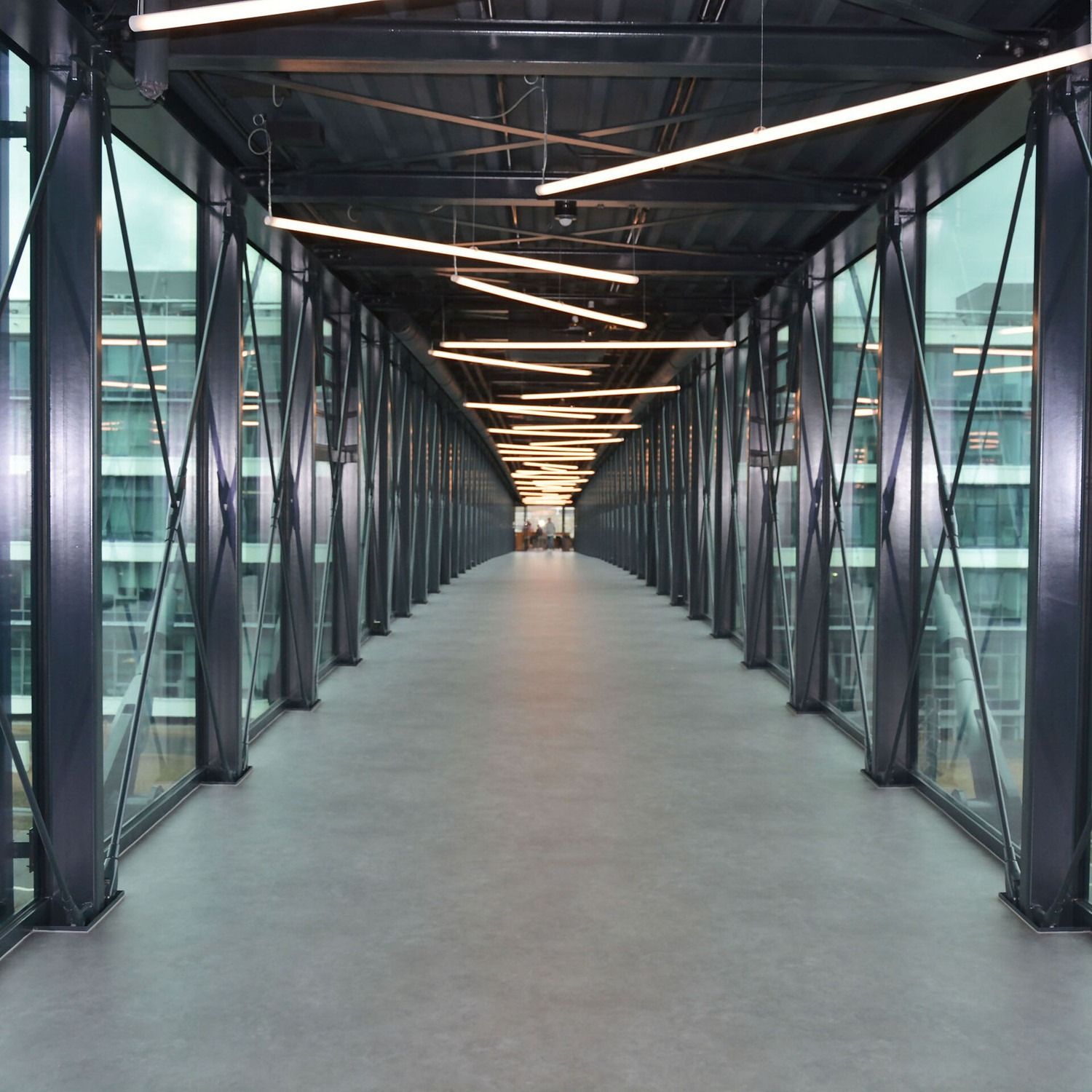 PUMA: Inside the glass skywalk with lights along the ceiling