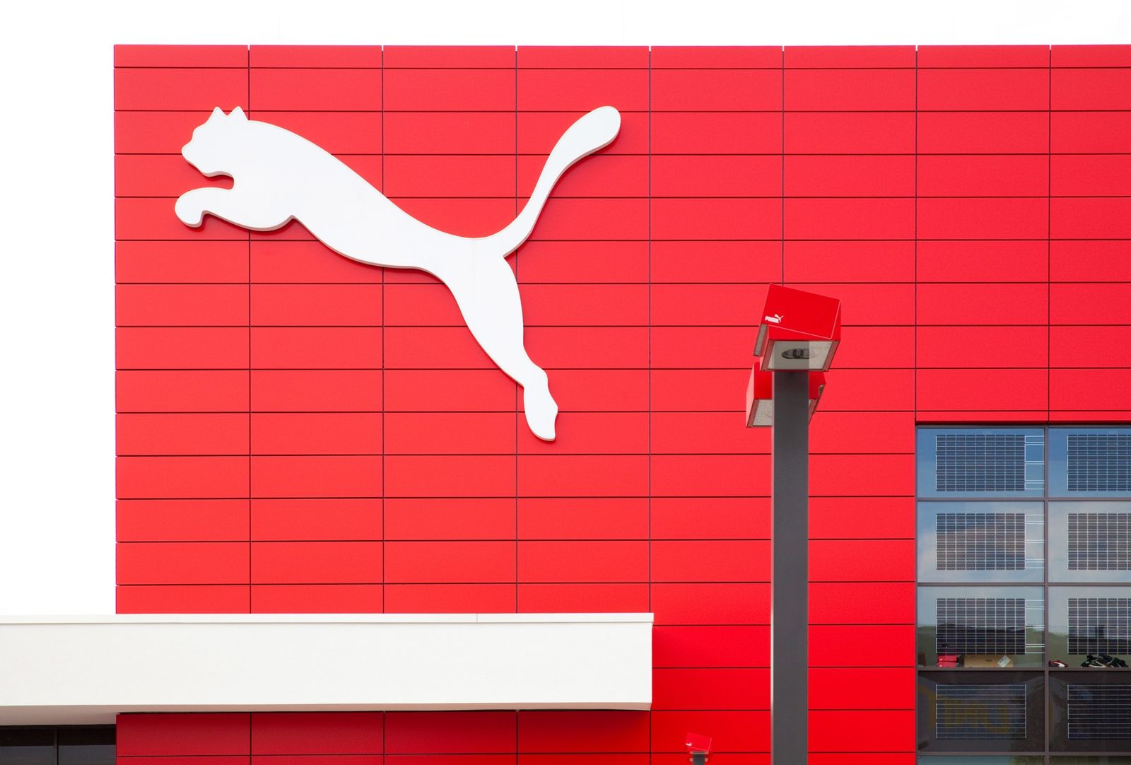 PUMA: Red facade with a large white cat logo