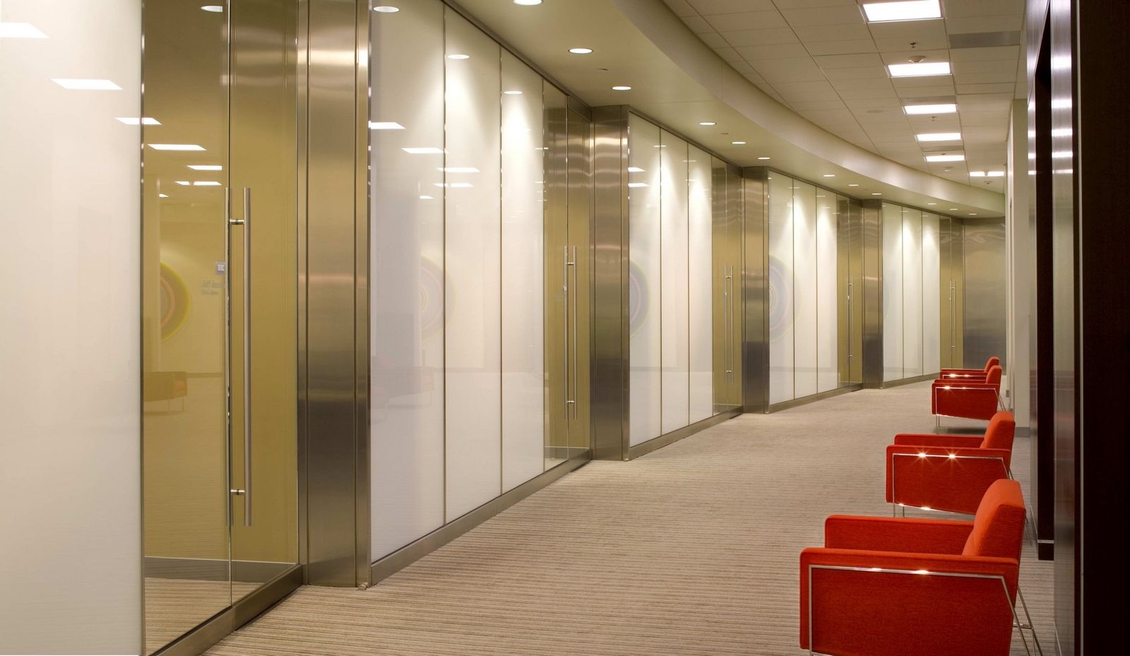 Qualcomm: Glass-walled offices along a corridor