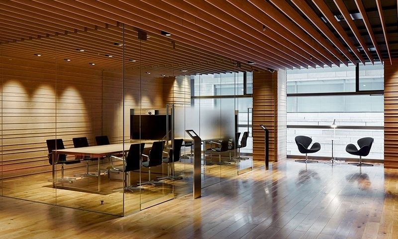 Rakuten Group: Glass-walled meeting room with wood-slatted ceiling