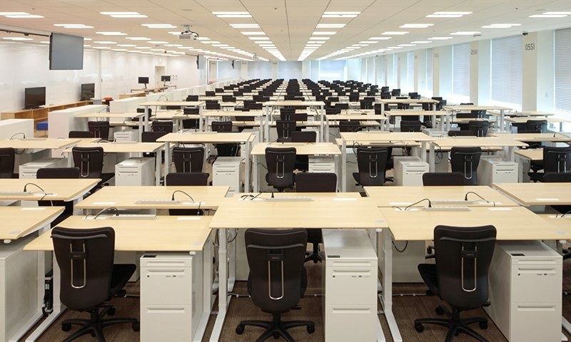 Rakuten Group: Rows of open desks with no dividers on a large office floor