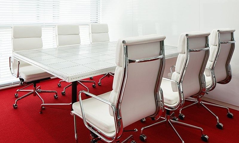 Rakuten Group: White meeting table with white leather office chairs