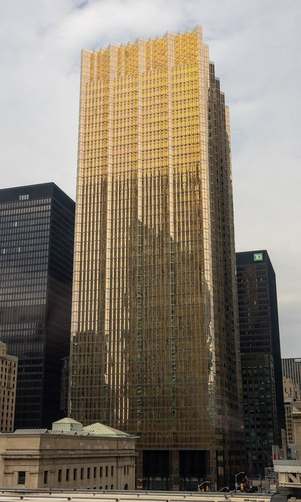 RBC (Royal Bank of Canada): Gold glass tower seen from an elevated park