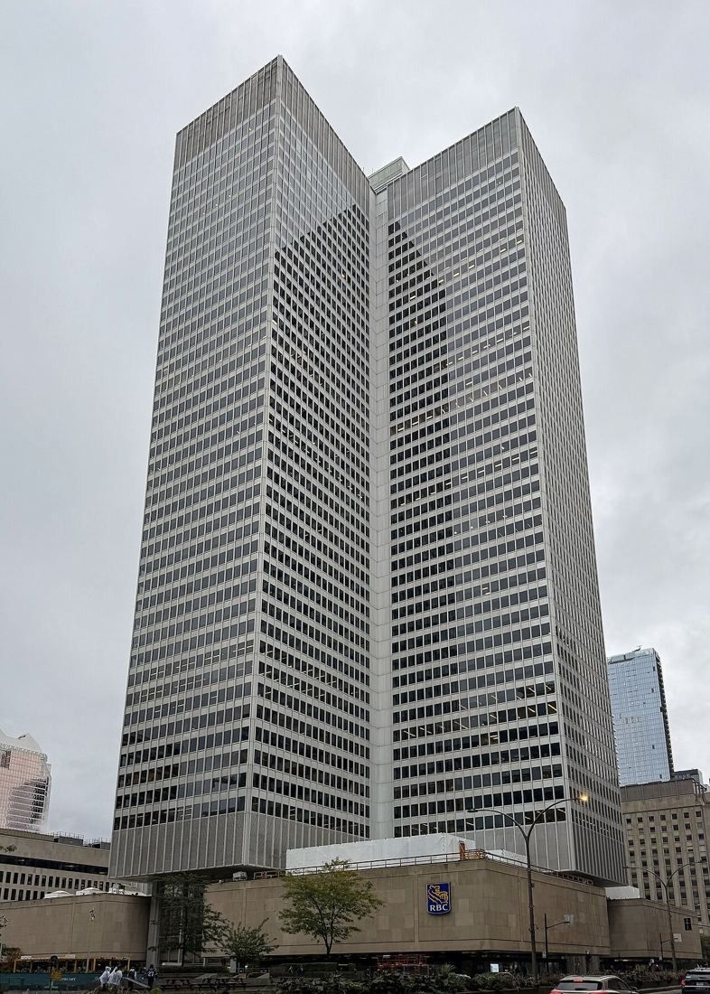 Cruciform grey office tower of Place Ville Marie seen from street level