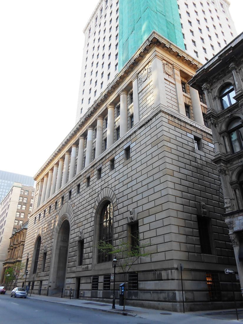 Massive stone bank building with tall arched windows on rue Saint-Jacques