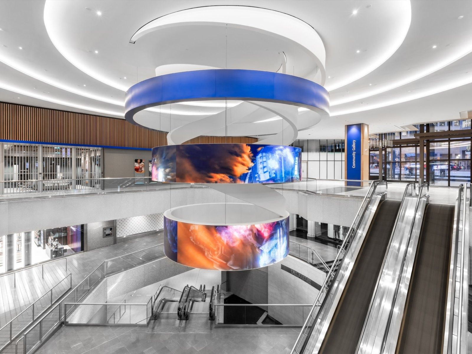 RBC (Royal Bank of Canada): Interior atrium with escalators and a suspended circular digital screen