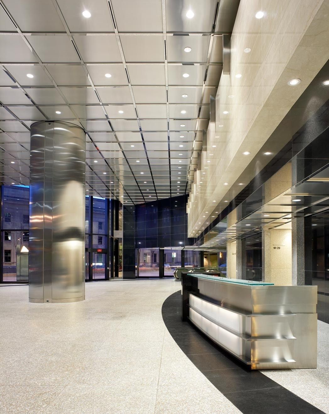 RBC (Royal Bank of Canada): Lobby with a curved reception desk and stone columns