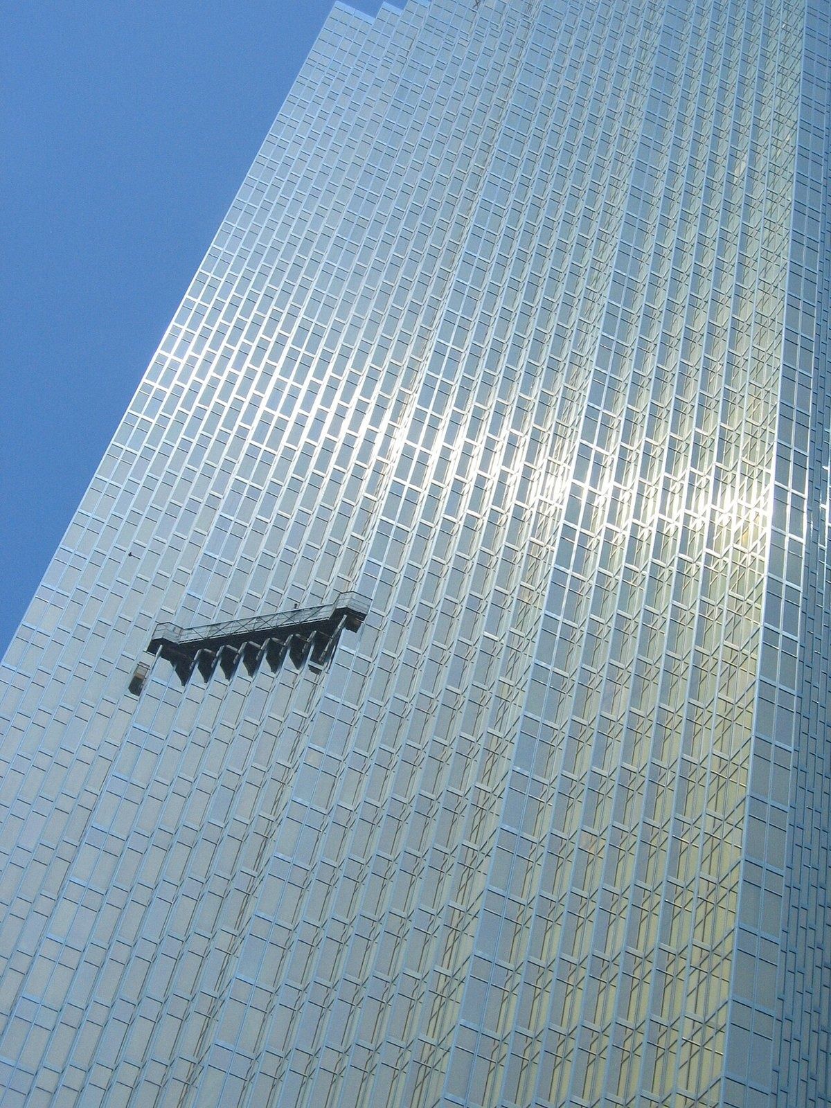 RBC (Royal Bank of Canada): Tall gold glass facade with a window-cleaning gondola