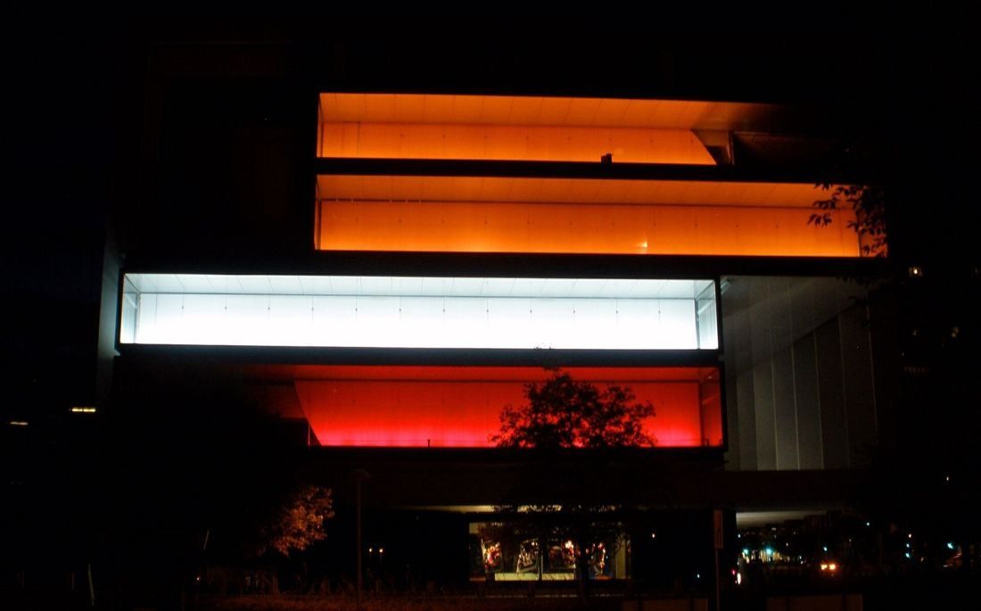 Repsol: Glowing orange and white bands of glass floors in the dark