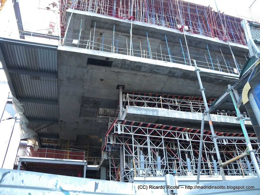 Repsol: Underside of a cantilevered concrete and steel floor with scaffolding