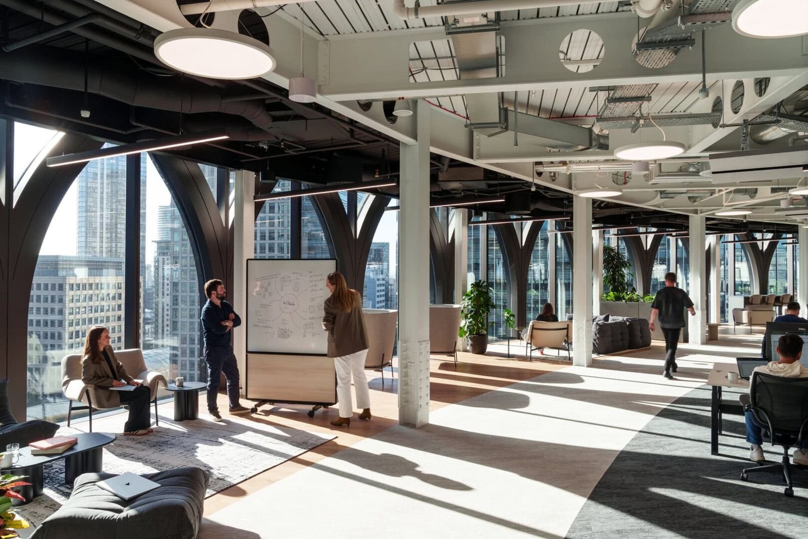 Revolut: Open floor with whiteboards under arched window frames