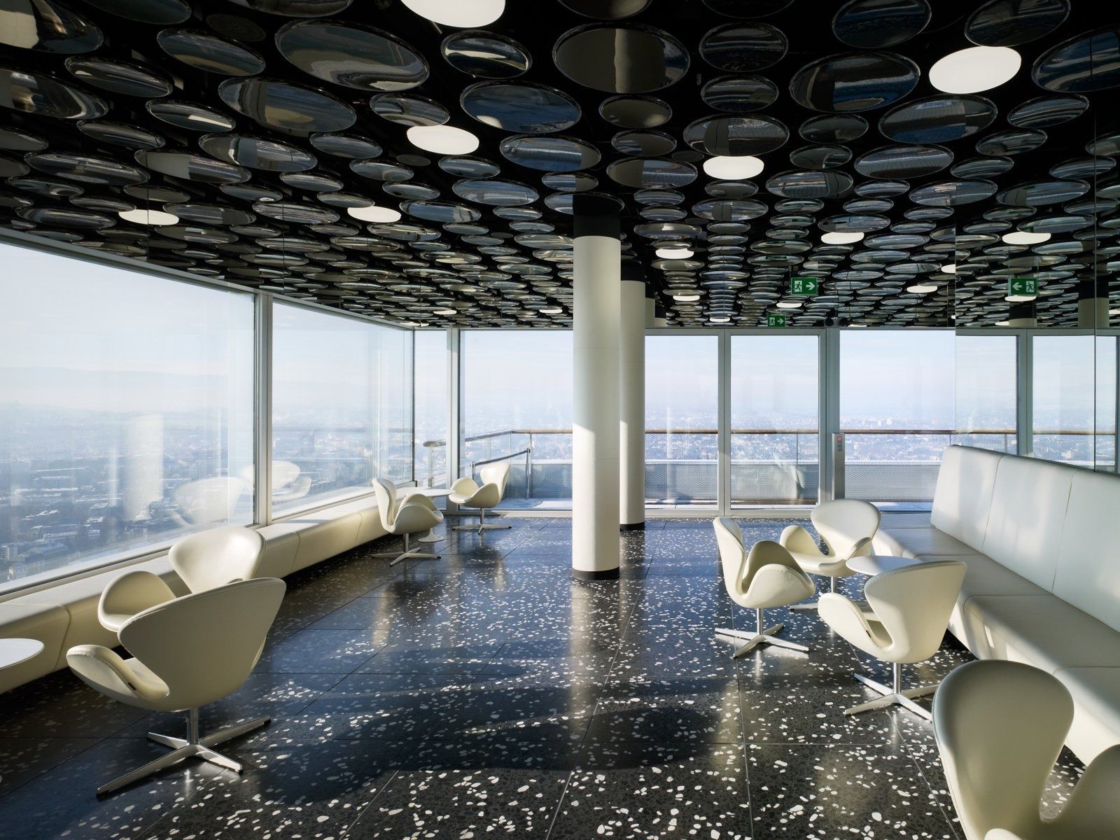 Roche: Top-floor cafeteria with dark terrazzo floor and a view over Basel