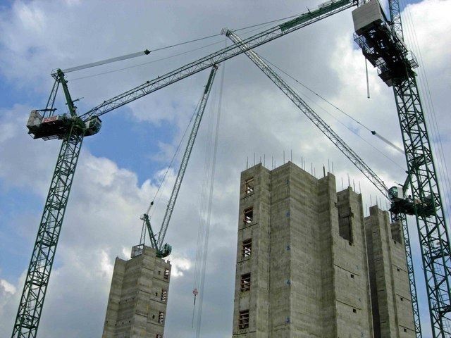Concrete frame of Kings Place rising between tower cranes