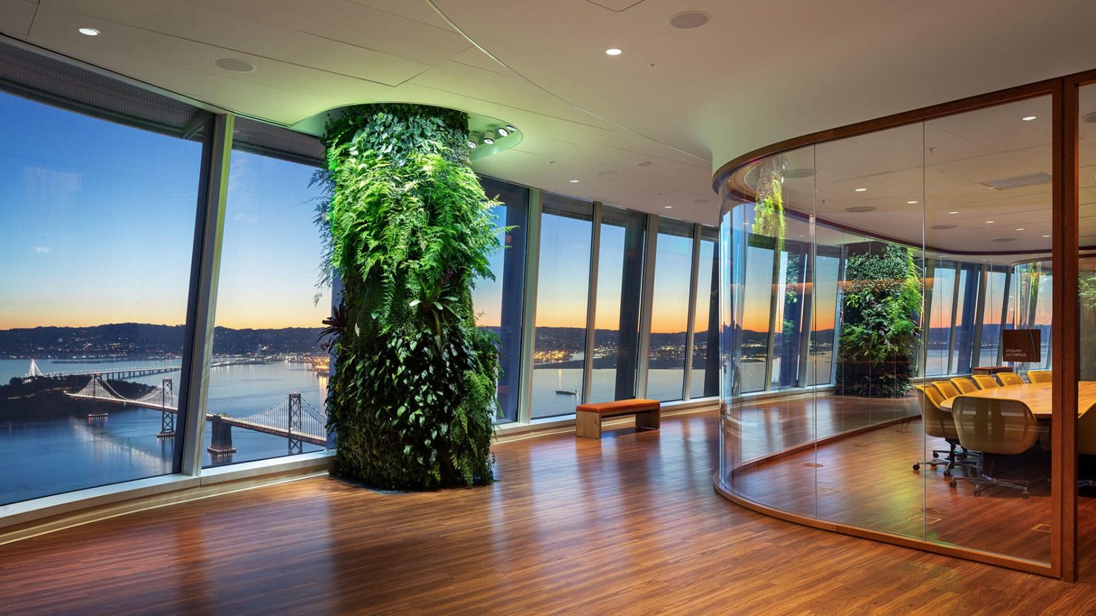 Salesforce: Room with a plant-covered column and bay views at dusk