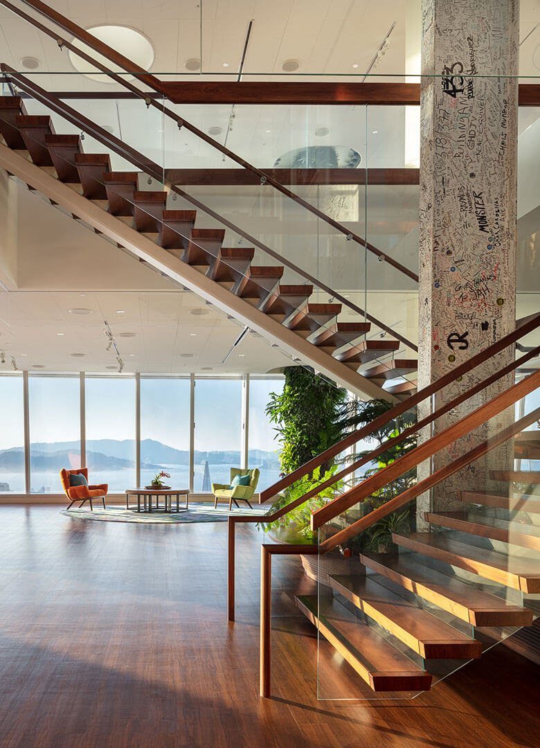 Salesforce: Wooden staircase with glass rails