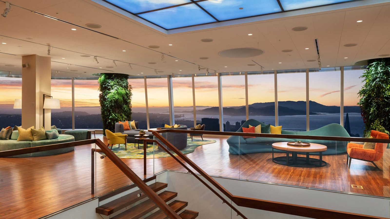 Lounge with sofas and plant columns at sunset