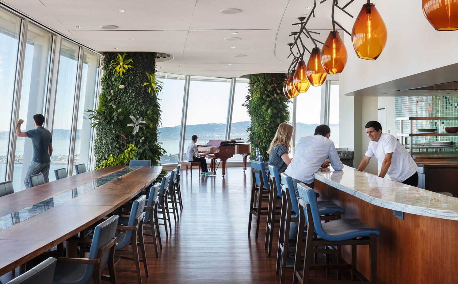 Salesforce: Long dining counter with amber pendant lamps