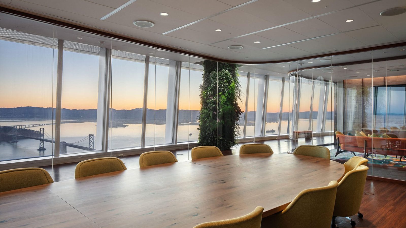 Salesforce: Long table with yellow chairs and bay views