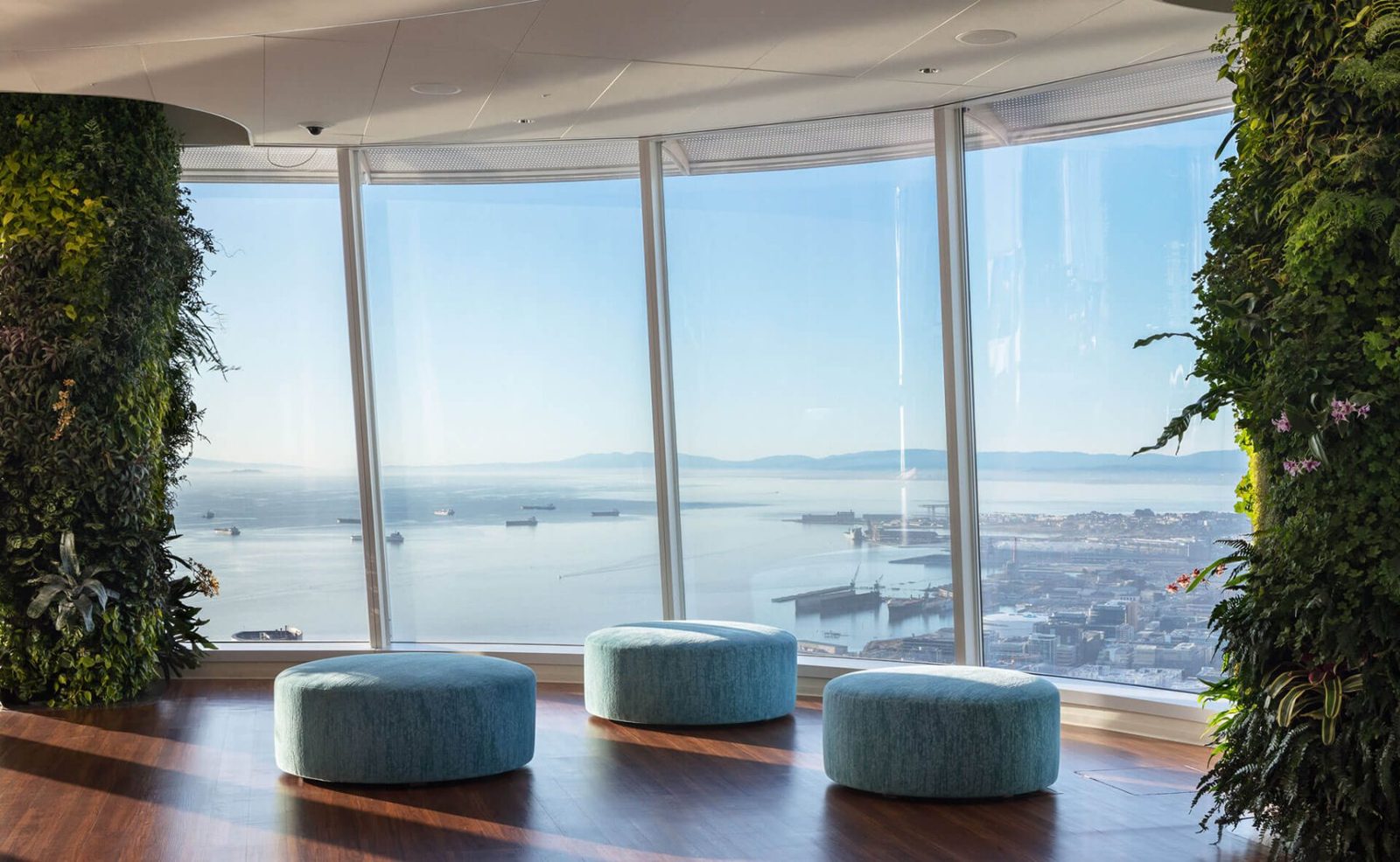 Salesforce: Round blue ottomans facing the bay