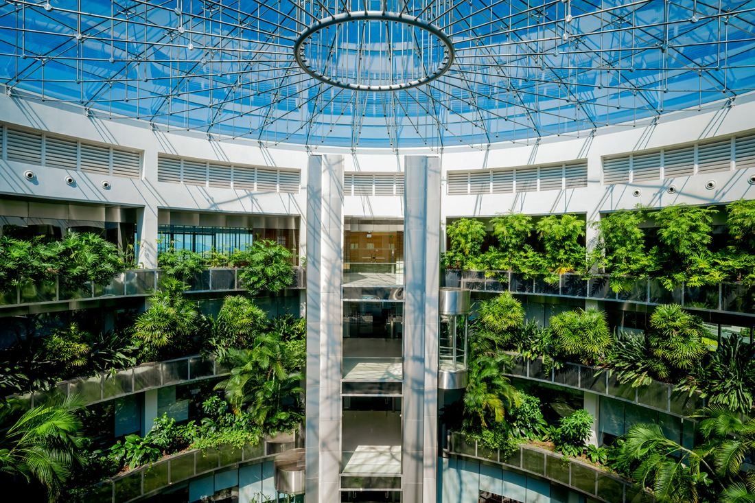 Banco Santander: Round atrium under a large glass dome, with planted balconies on every floor