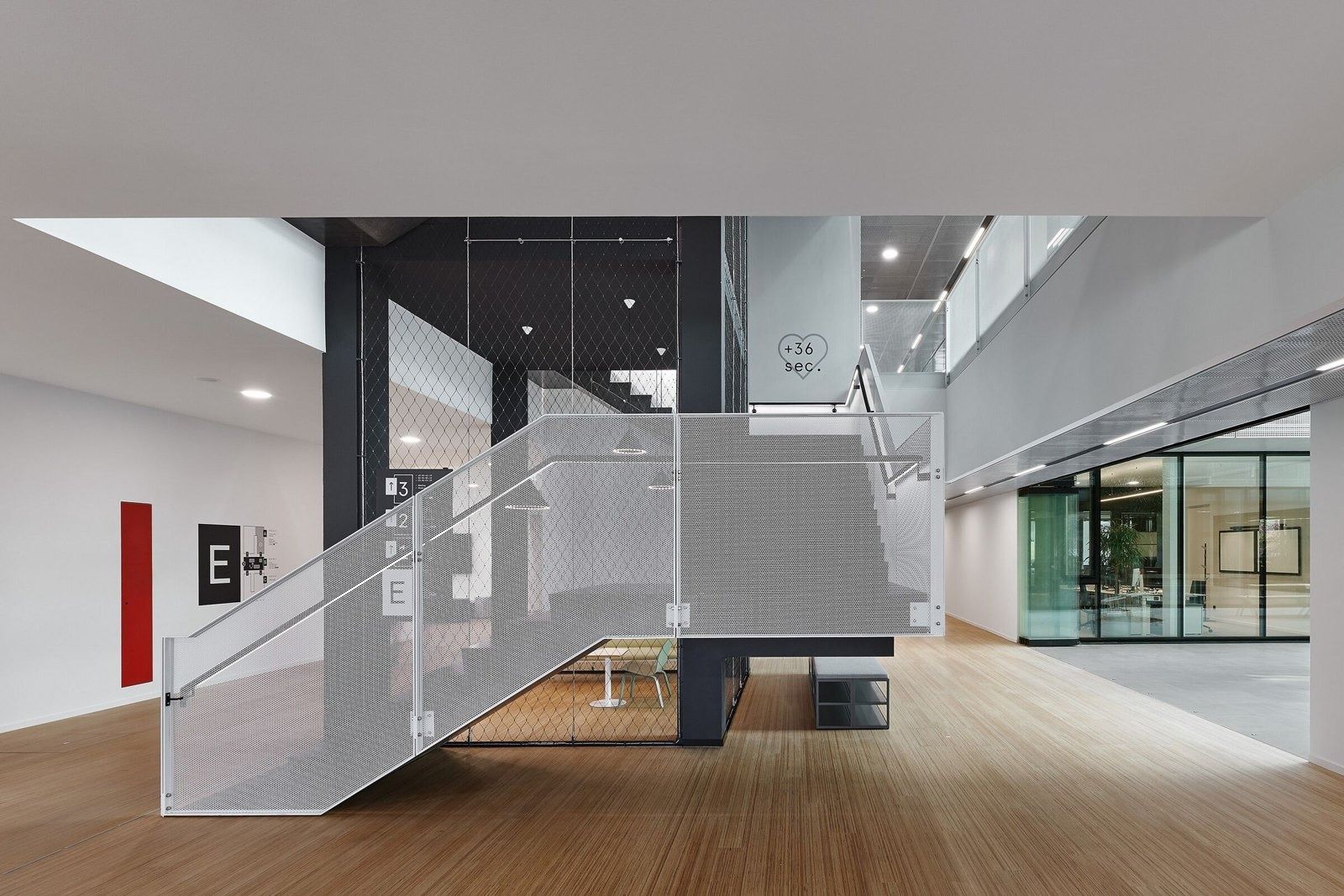 SAP: A sculptural stair with mesh railings