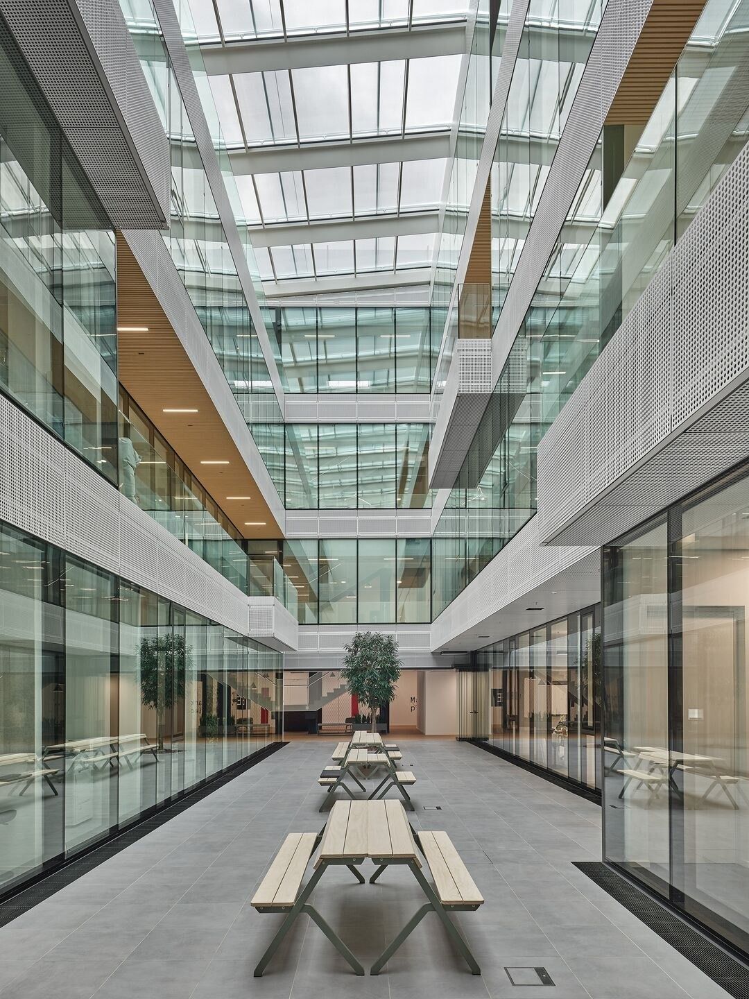 SAP: Picnic tables in a glazed courtyard
