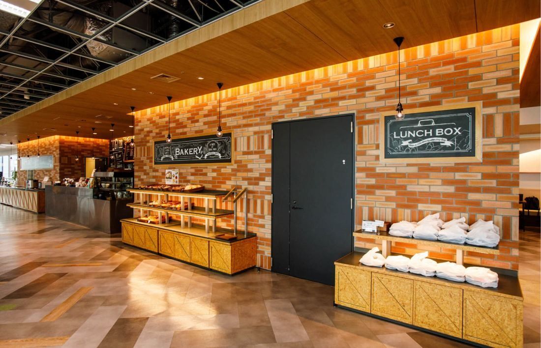 SEGA: Brick-walled counter with displays labeled Bakery and Lunch Box