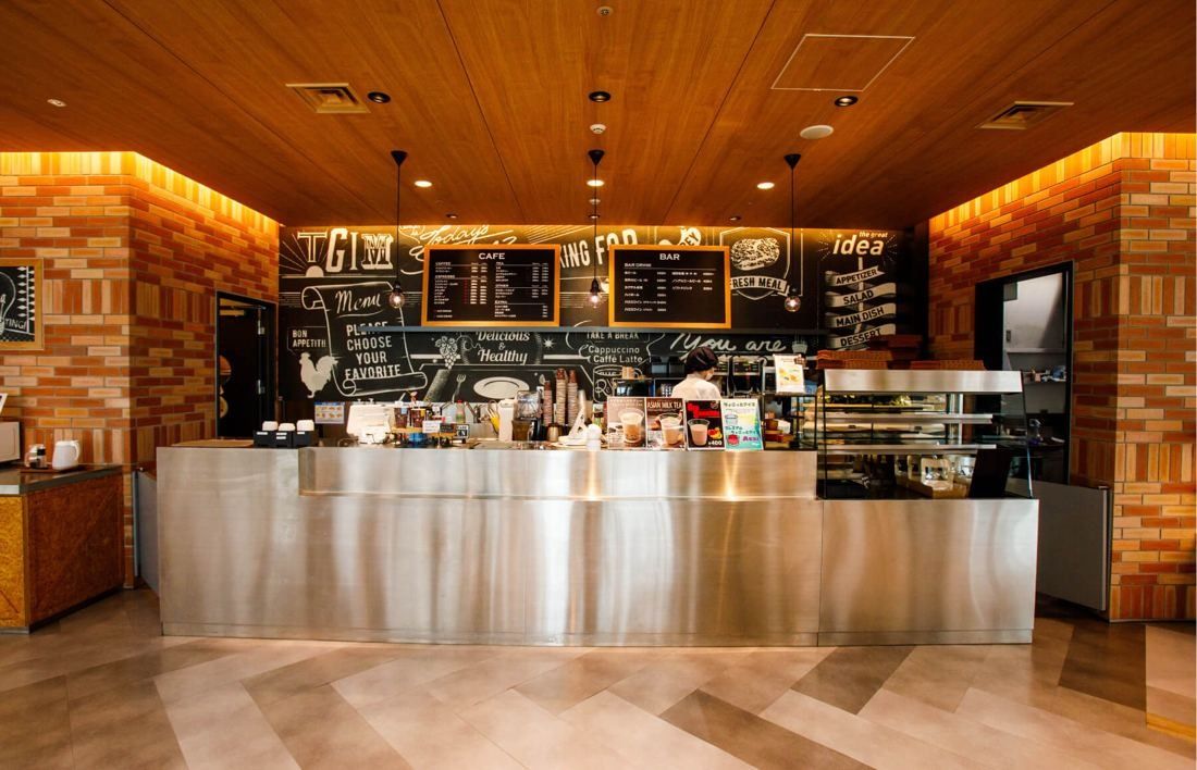 SEGA: Coffee bar counter with stainless front and chalkboard menus