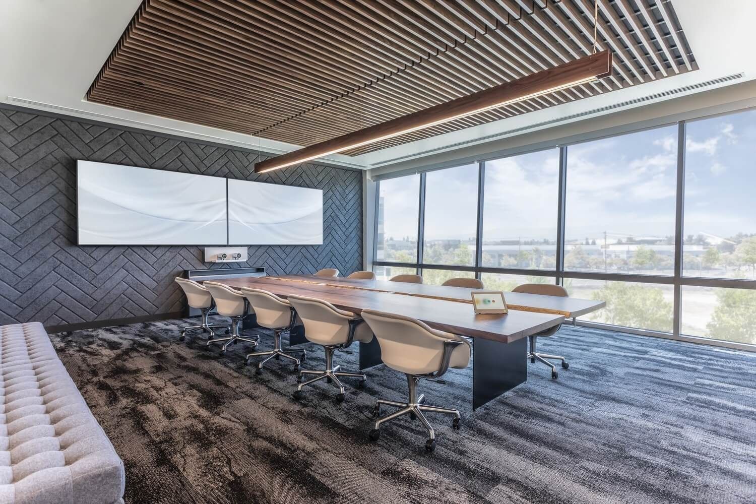 ServiceNow: A boardroom with a long table and floor-to-ceiling windows