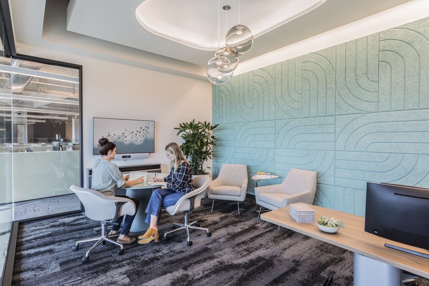 ServiceNow: A small meeting area with a green patterned wall