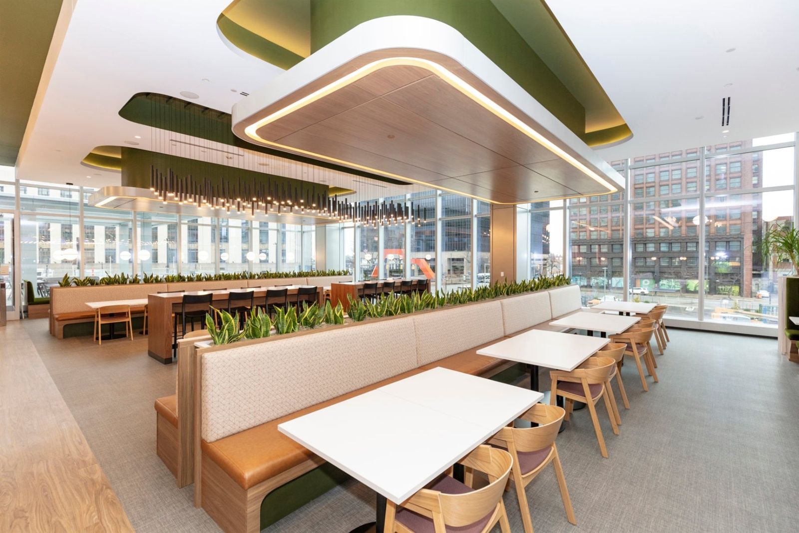 Sherwin-Williams: Cafeteria with long booths and wooden tables beside floor-to-ceiling windows