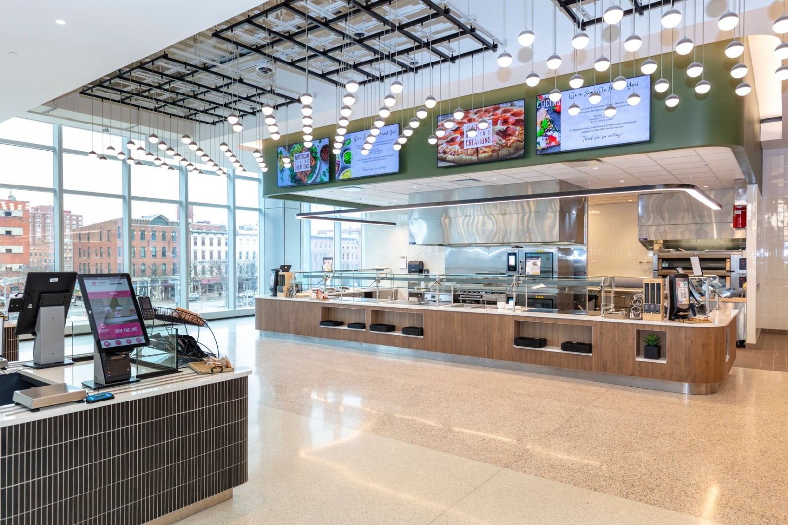 Sherwin-Williams: Food service counters under screens and a lit ceiling grid