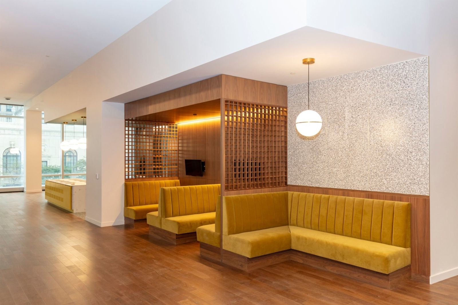 Sherwin-Williams: Mustard-yellow booths in wooden alcoves